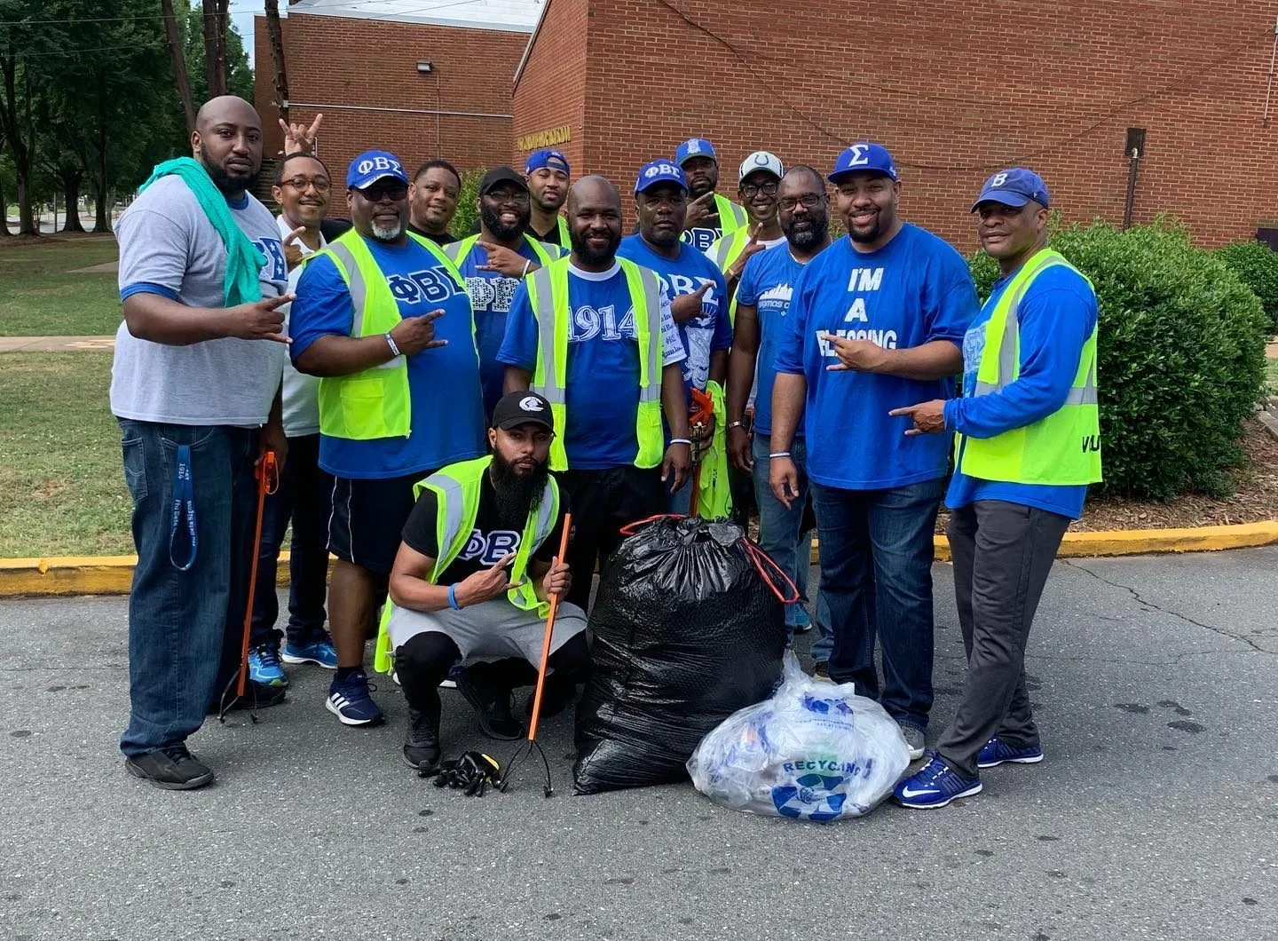 Brothers in safety vests during a community cleanup