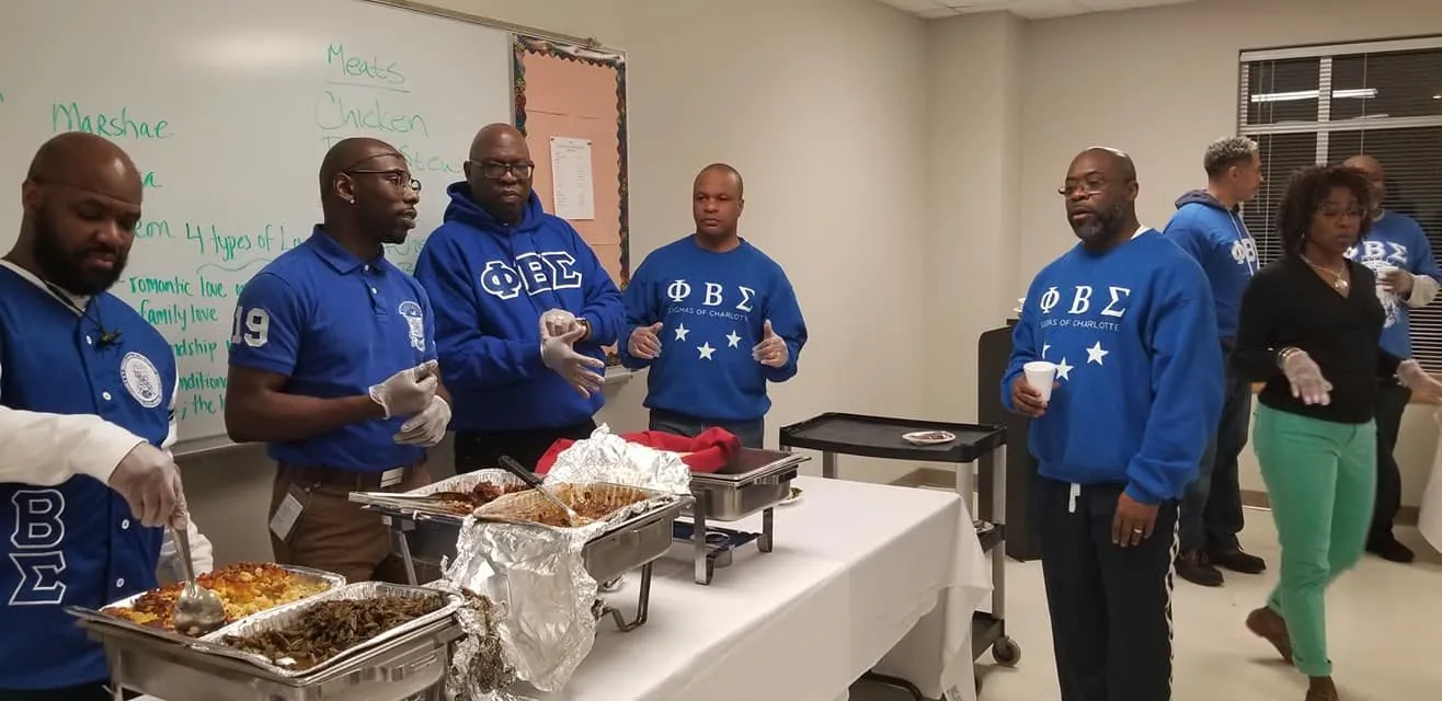 Brothers serving meals to the community