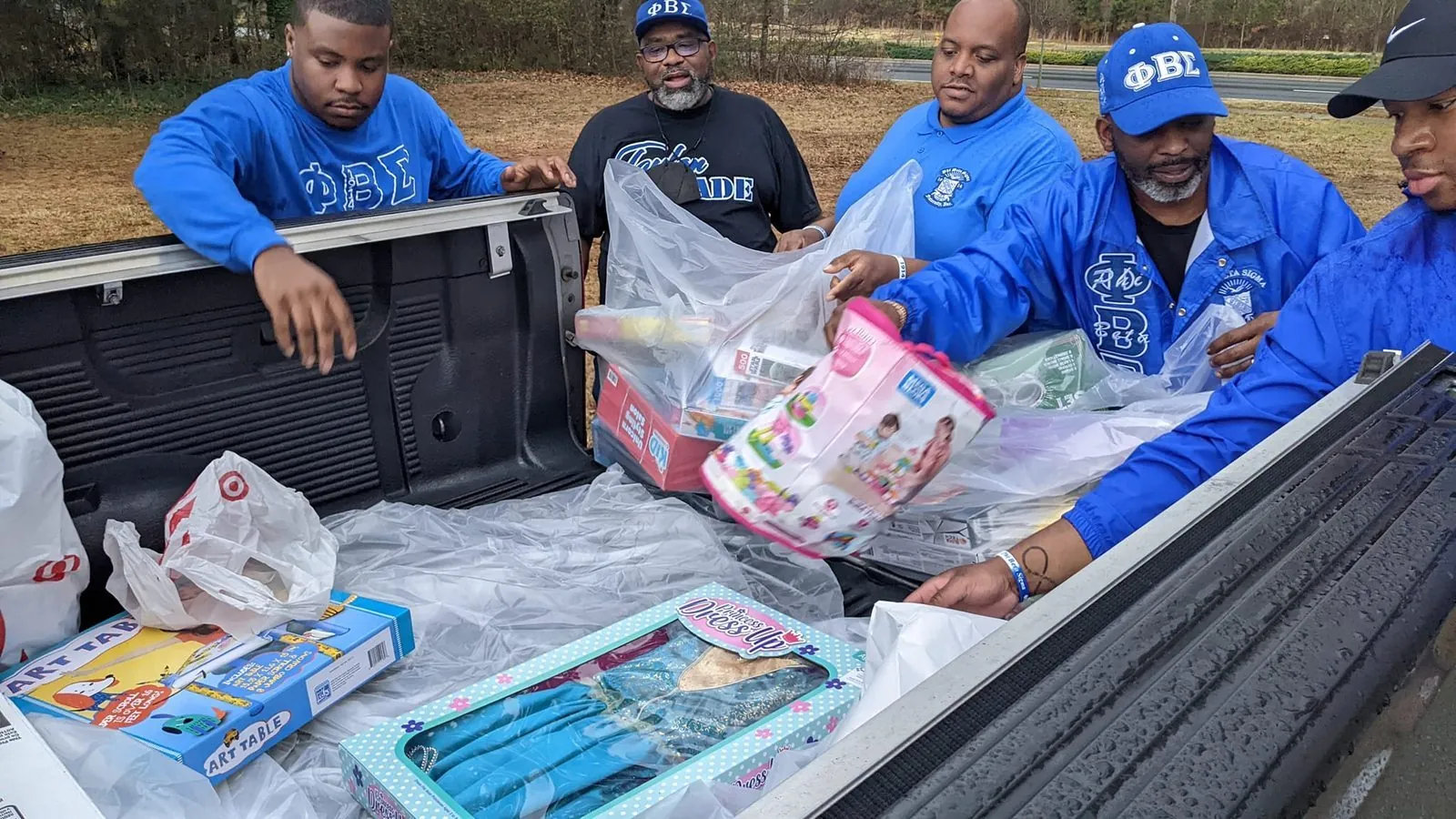 Brothers loading donated goods for community distribution