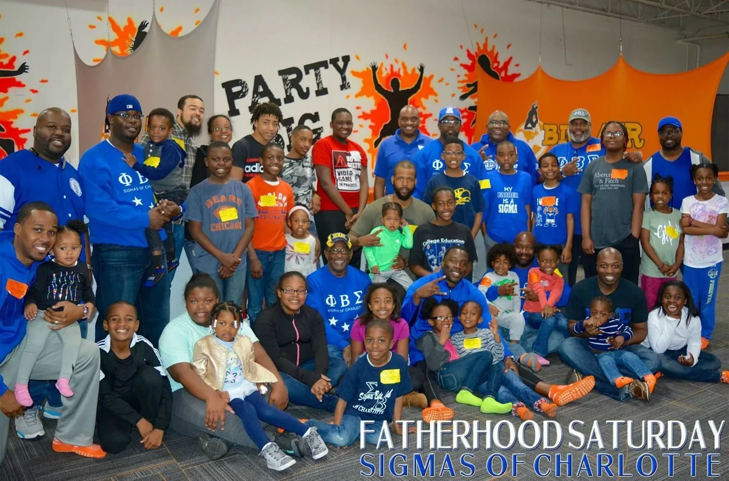Brothers and youth at a chapter community event